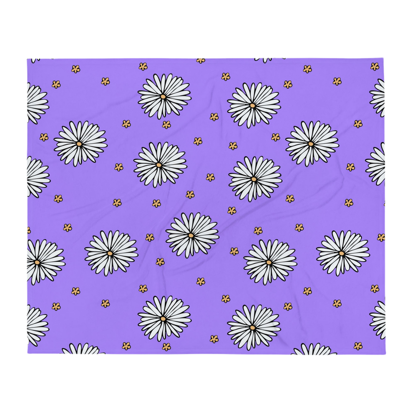 A photo of a purple blanket patterned with hand-drawn white daisies with yellow centres and miniature hand-drawn yellow flowers.