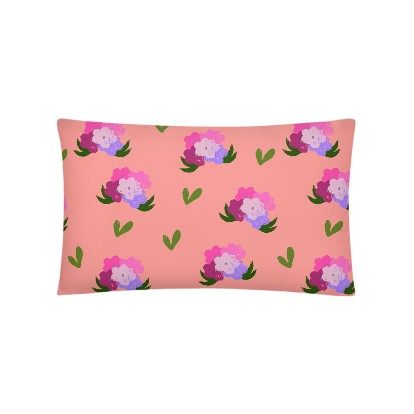 A photo of a soft pink pillow adorned with hand-drawn green leaves and bouquets of flowers in shades of pink and purple.