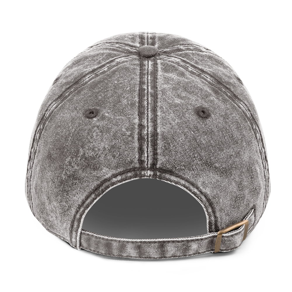 The back of a vintage charcoal grey cotton twill cap.
