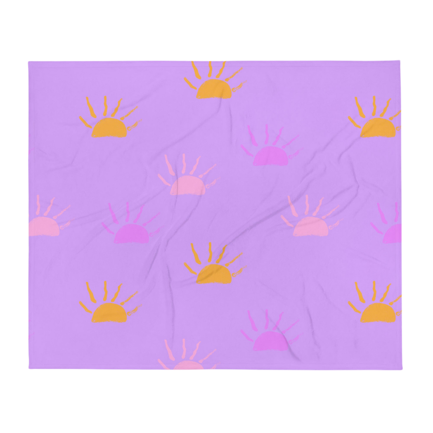 A photo of a purple blanket featuring hand-drawn sunsets in pink, purple and orange. 