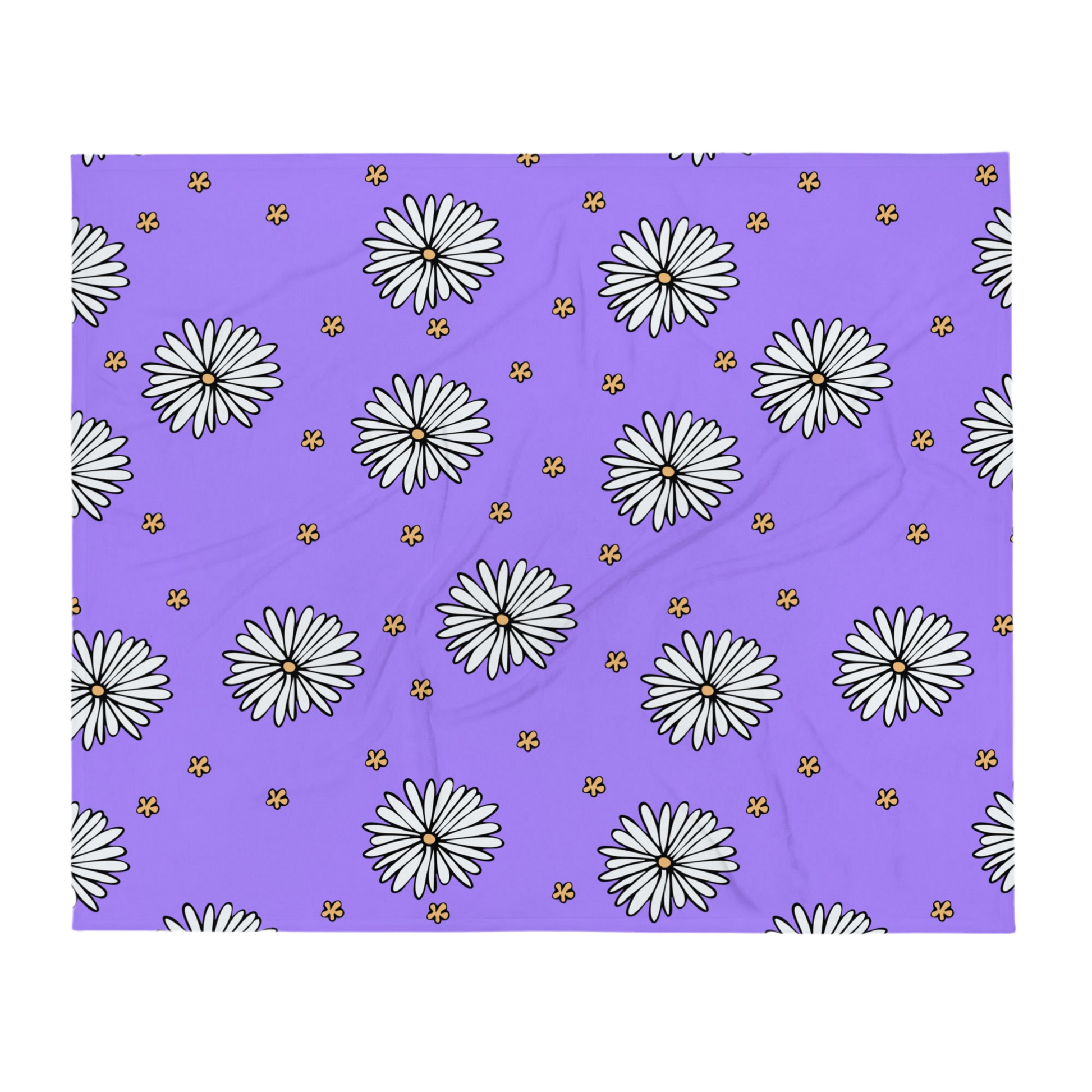 A photo of a purple blanket patterned with hand-drawn white daisies with yellow centres and miniature hand-drawn yellow flowers. 