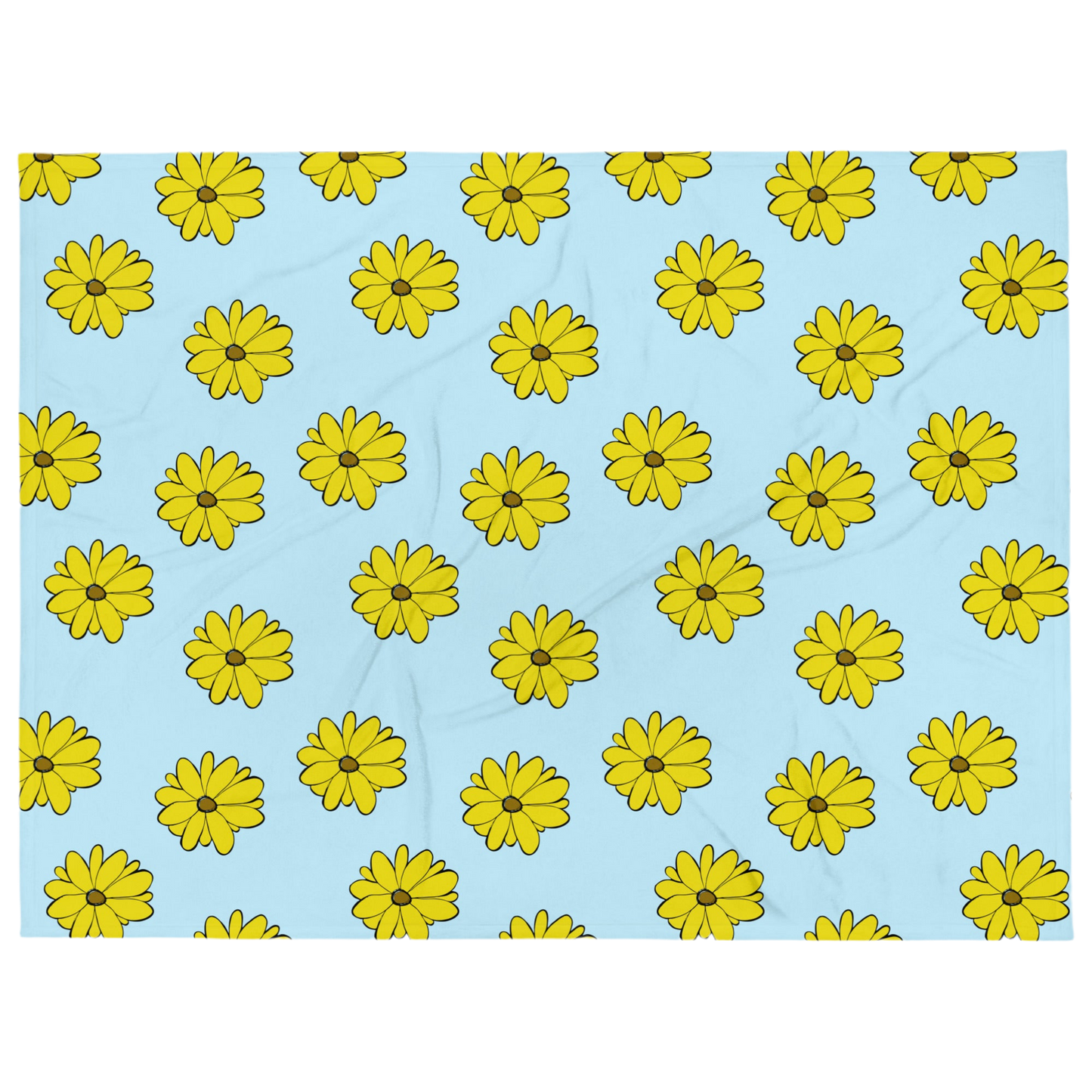 A photo of a blue blanket with a pattern of vibrant yellow sunflowers with brown centres.