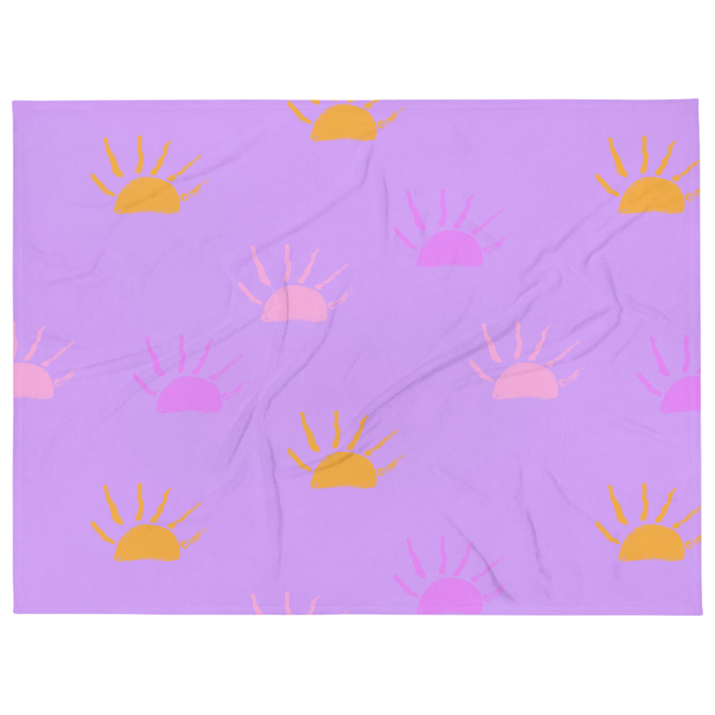 A photo of a purple blanket featuring hand-drawn sunsets in pink, purple and orange. 