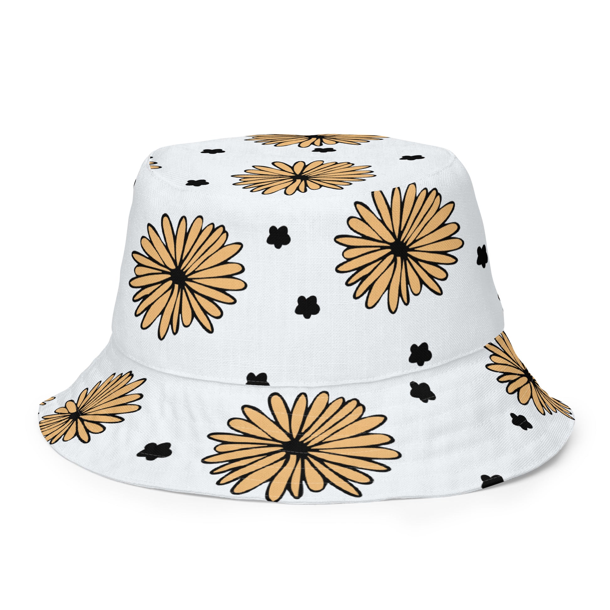 A photo of a white bucket hat patterned with hand-drawn yellow daisies with black centres and miniature hand-drawn black flowers. 