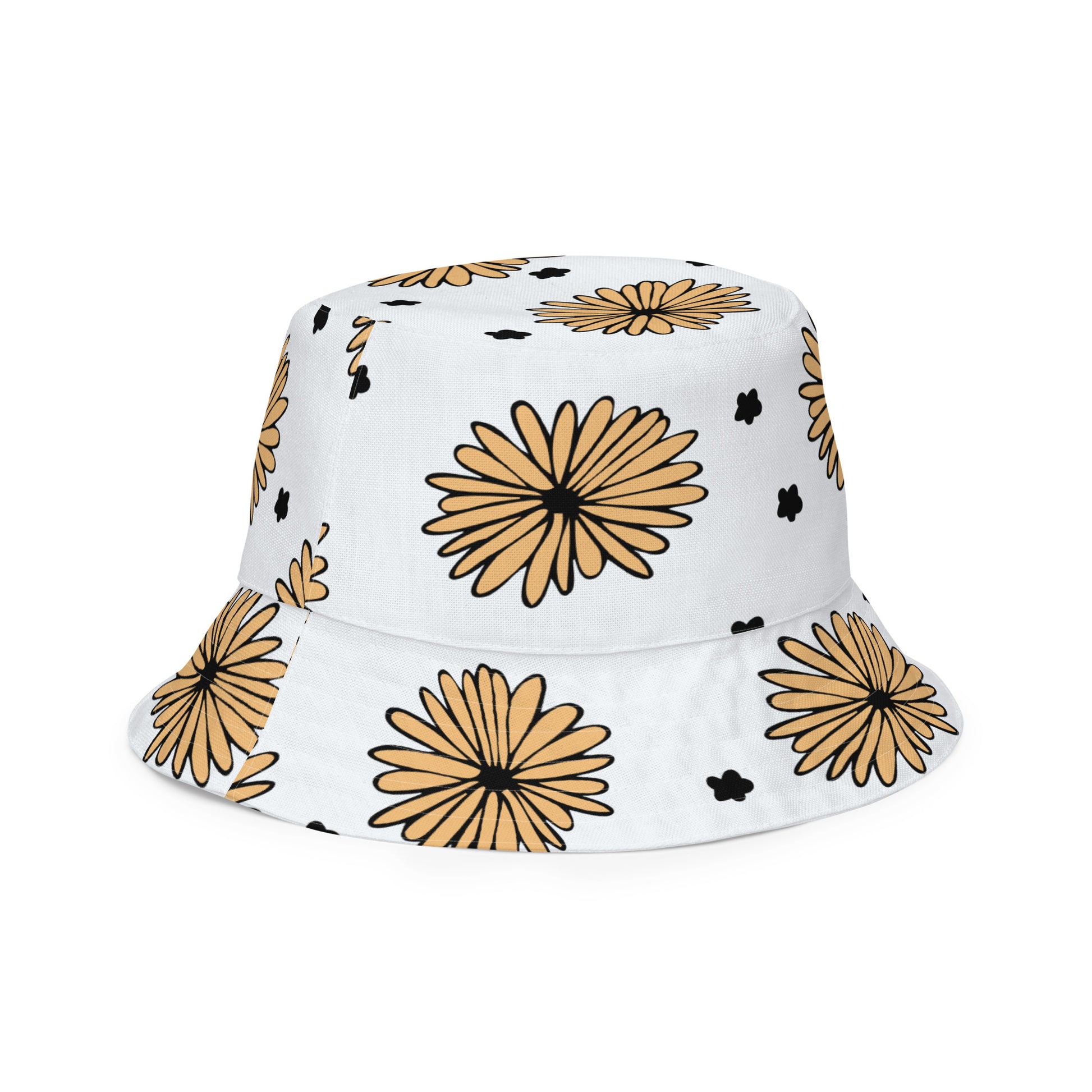 A photo of a white bucket hat patterned with hand-drawn yellow daisies with black centres and miniature hand-drawn black flowers. 