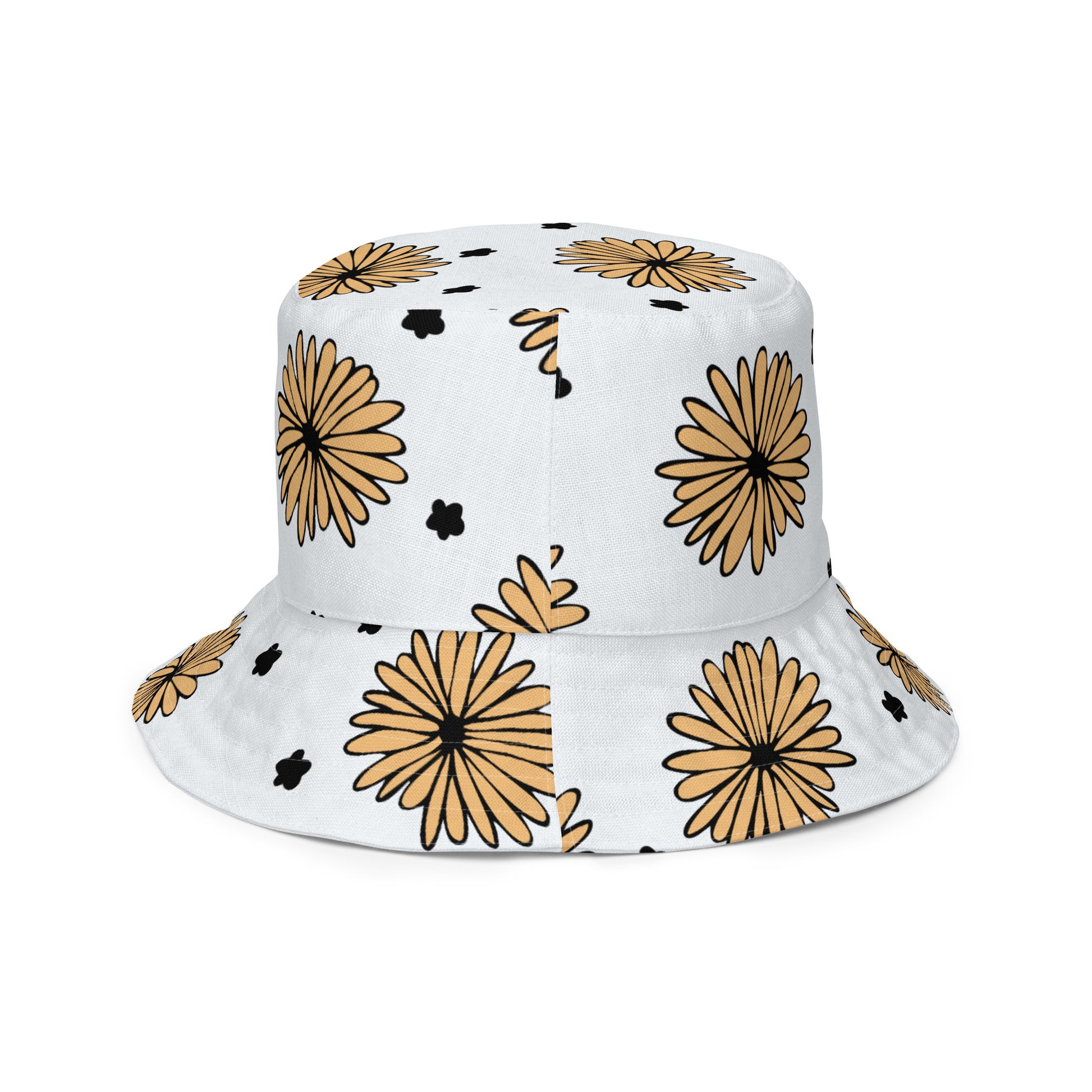 A photo of a white bucket hat patterned with hand-drawn yellow daisies with black centres and miniature hand-drawn black flowers. 