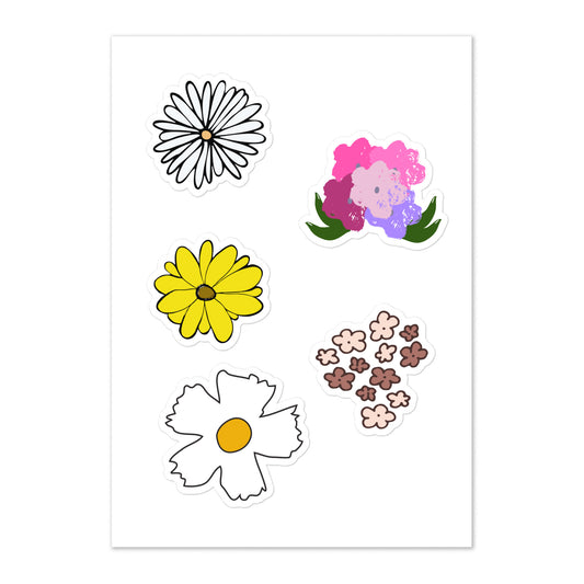 A photo of a sticker sheet showcasing hand-drawn/hand-painted flower stickers - a white daisy with a yellow centre, a bouquet of flowers in shades of pink and purple with green leaves, a yellow sunflower with a brown centre, a bunch of little flowers in neutral shades of brown, and another white daisy with a yellow centre. 