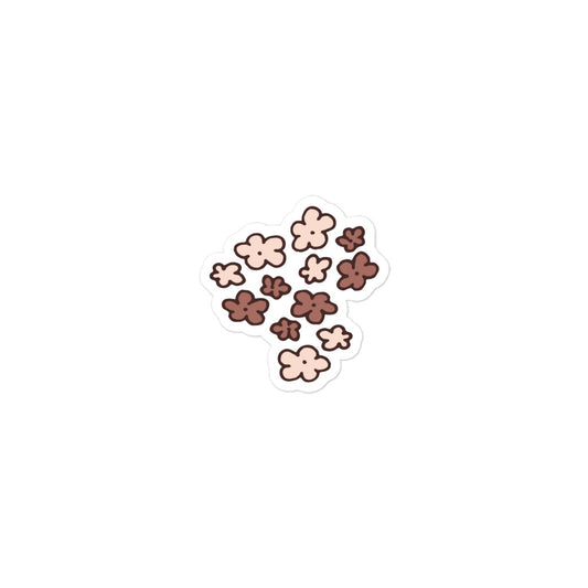 A hand-drawn sticker of a bunch of little flowers in neutral brown tones. 