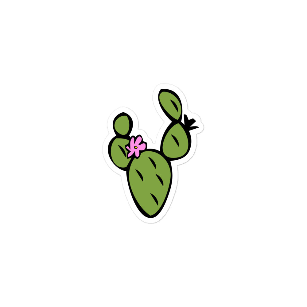 A photo of a hand-drawn green cactus sticker with a pink flower.