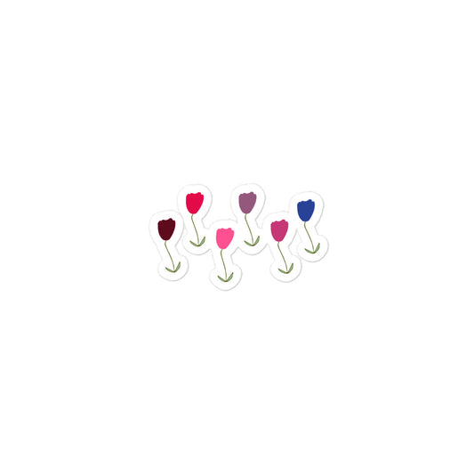 A hand-drawn tulips sticker in shades of red, blue and purple with green stalks and leaves. 