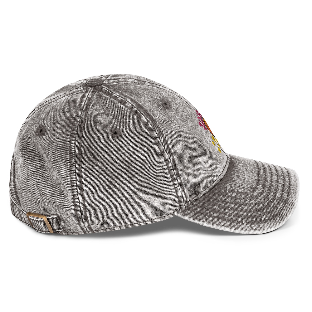 A photo of the side of a charcoal grey cotton twill cap.