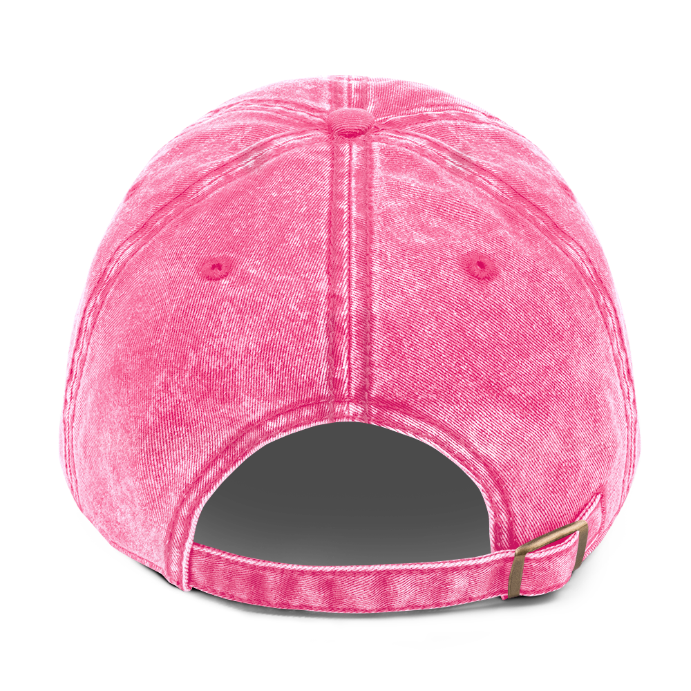 A photo of the back of a pink cotton twill cap.