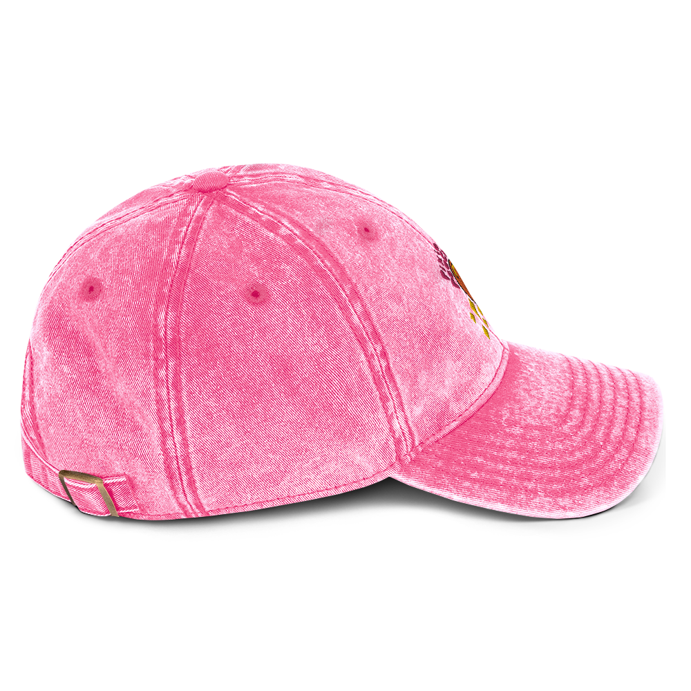 A photo of the side of a pink cotton twill cap.